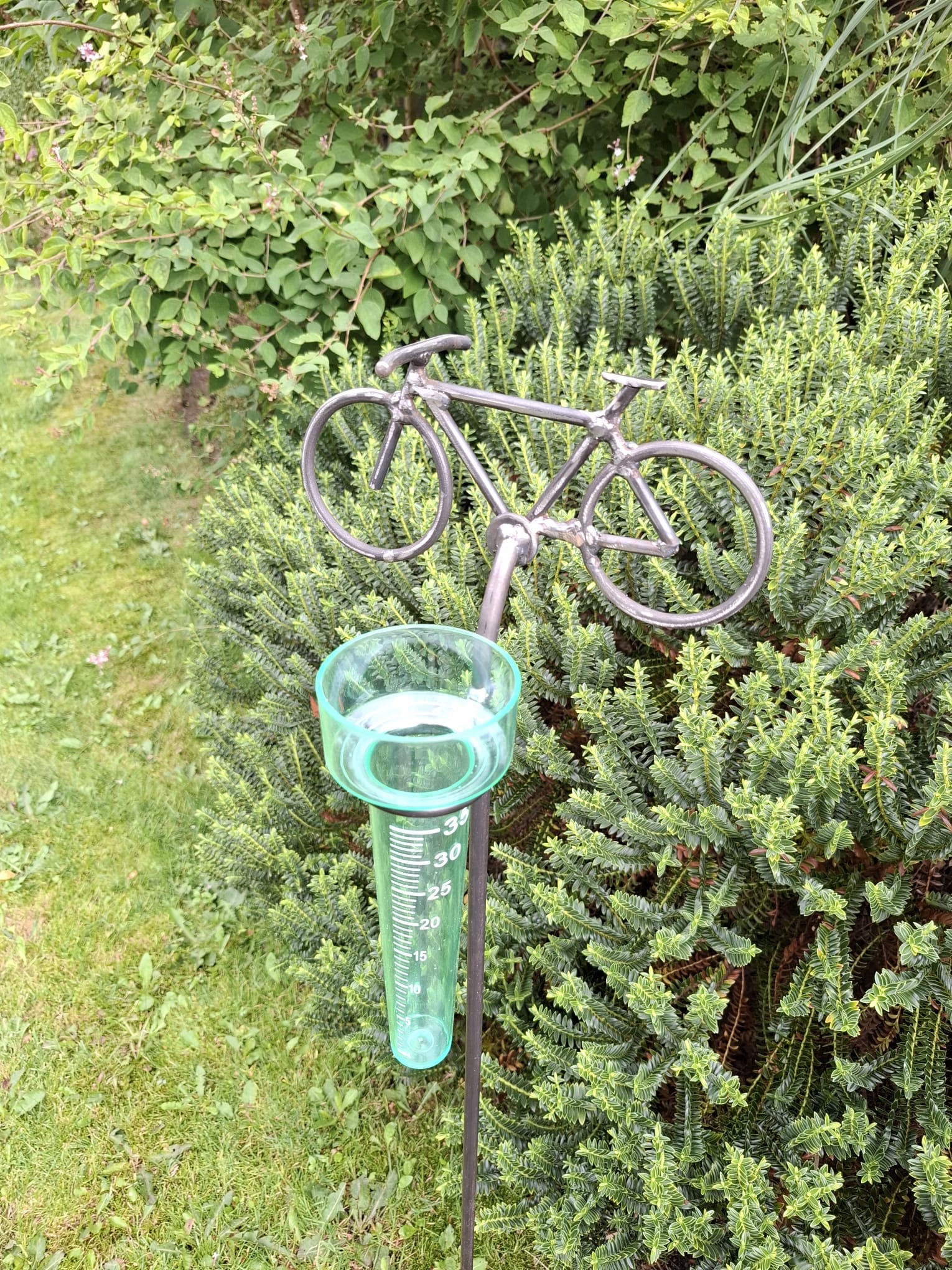 Leuke regenmeter met fiets